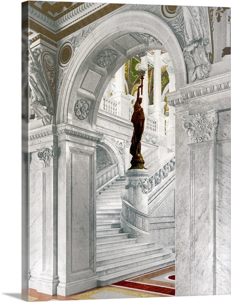 Big, vertical vintage photograph of  the elaborate North staircase in the Library of Congress, a statue on a pillar at the...