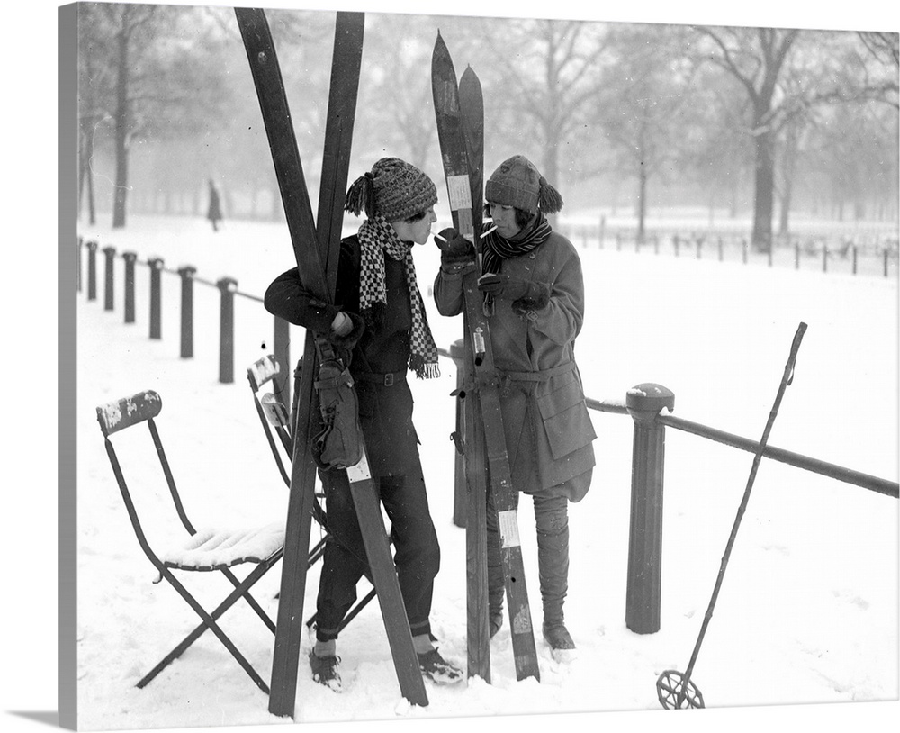 The Misses Debenham stopping for a smoke before going skiing in Hyde Park