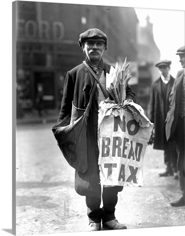 A newspaper vendor with the day's headlines, 'No Bread Tax'