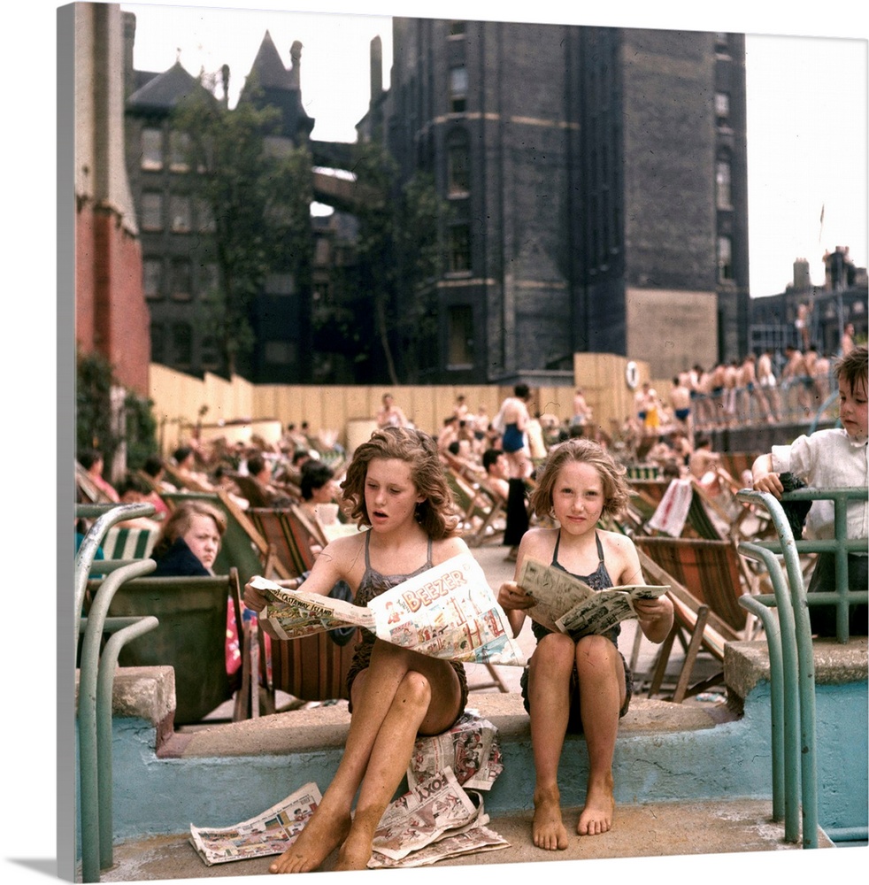25th May 1956:  Sun worshippers and swimmers relax at the Oasis outdoor swimming pool in Holborn, London