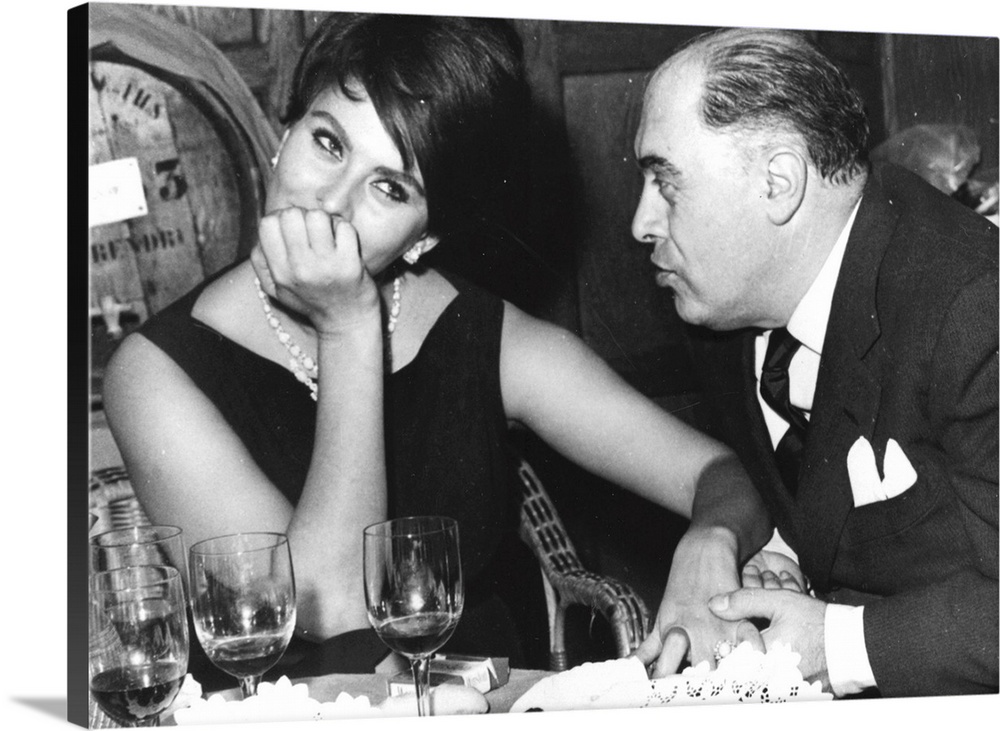 Italian film actress Sophia Loren in a restaurant in France with her husband Carlo Ponti, the man credited with discoverin...