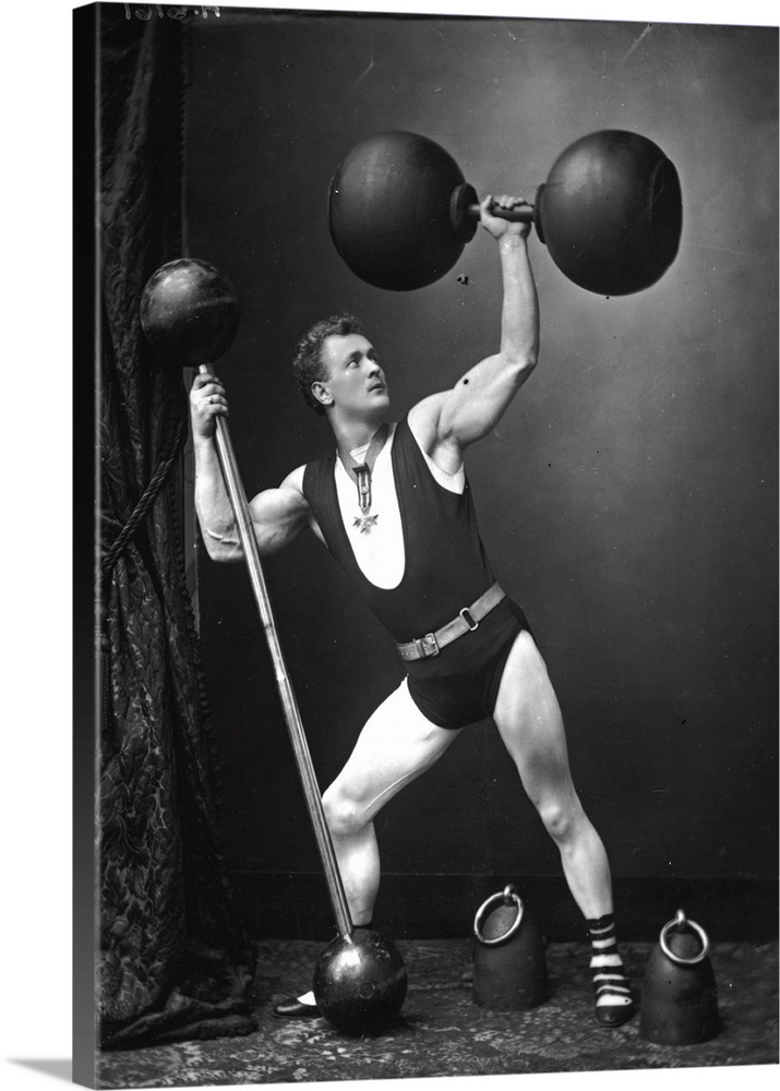 circa 1890:  German strongman Eugene Sandow lifting weights and dumbbells