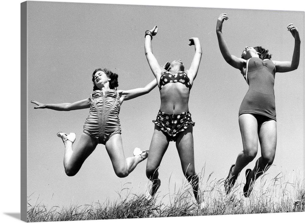 Three Windmill Theatre dancers enjoying the sun on the beach at Angmering during a break in rehearsals