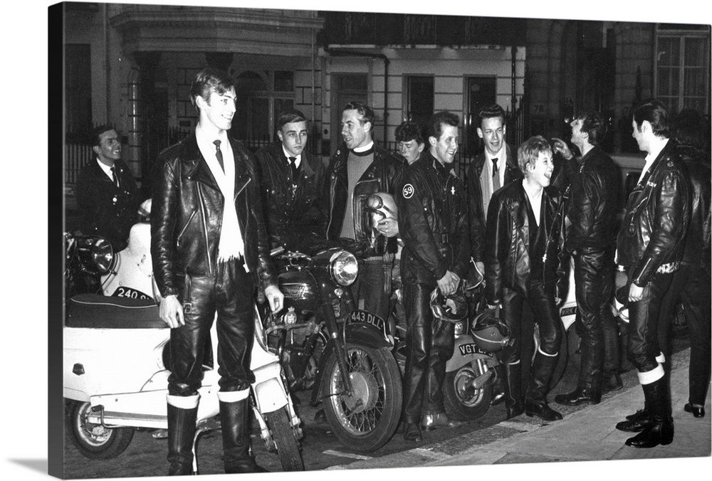 A group of 'Ton-Up' boys standing beside their motorbikes at the Dorchester Hotel, London Father William Shergold seen centre