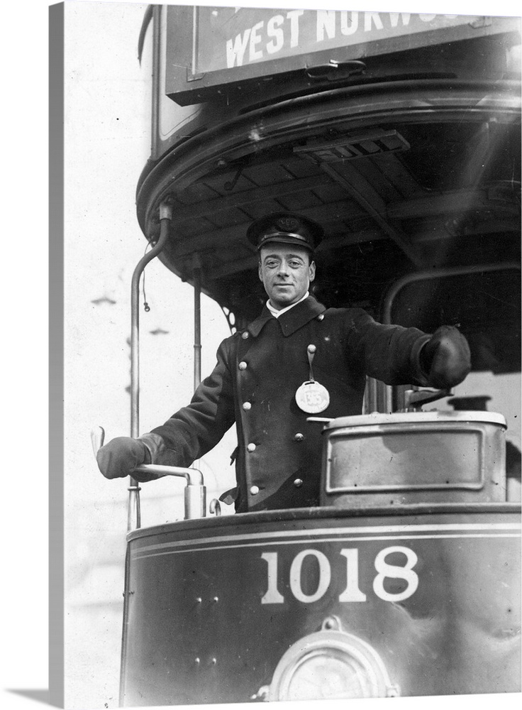 April 1910:  The driver of an electric tram
