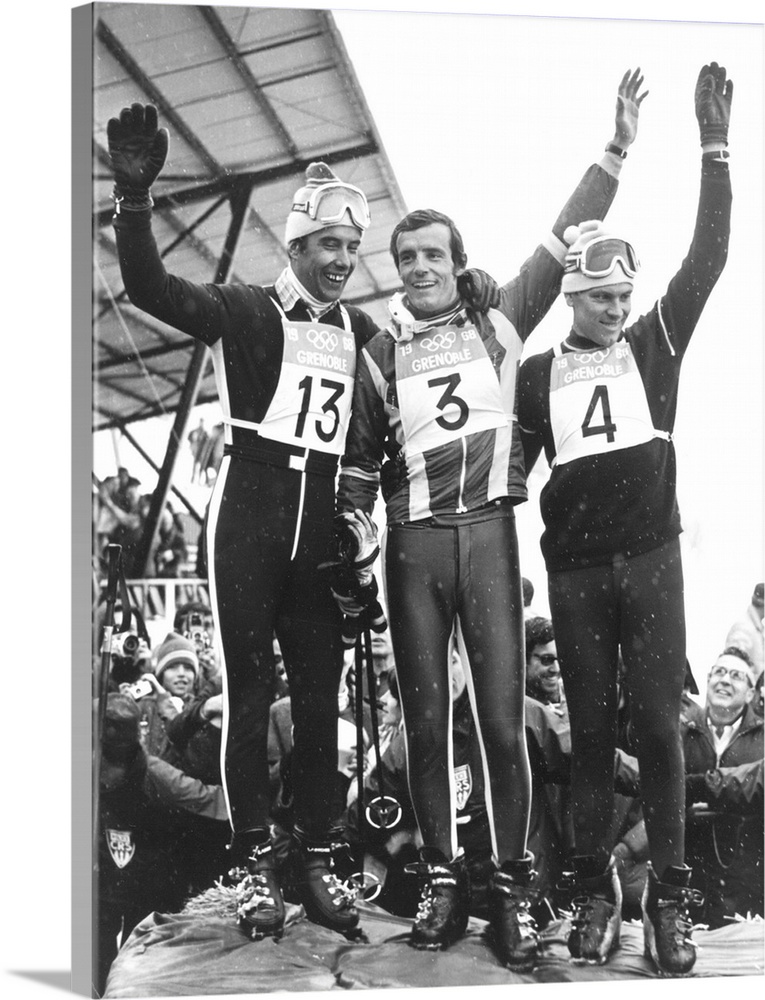 13 FEB 1968:  JEAN-CLAUDE KILLY (CENTRE) CELEBRATES ON THE SLOPES AFTER WINNING THE GOLD MEDAL FOR THE GIANT SLALOM WITH W...