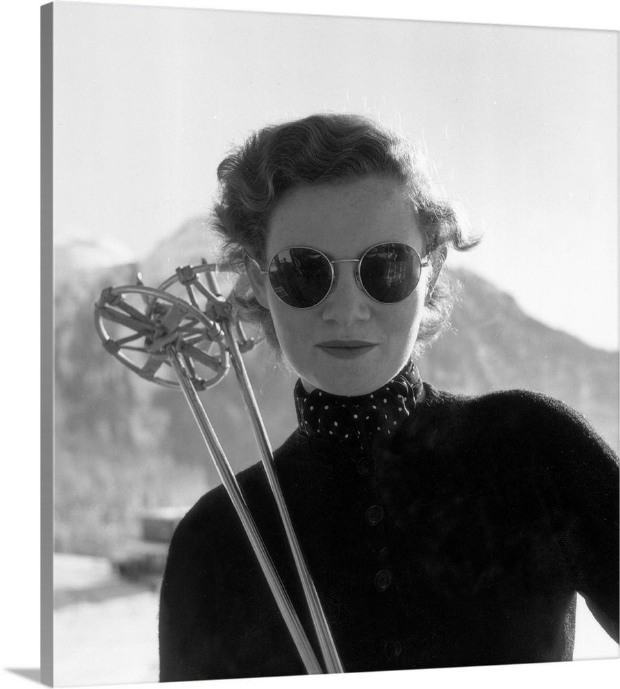 26th January 1952:  One of the British women's Olympic Ski Team with her skis Original Publication: Picture Post - 5661- S...