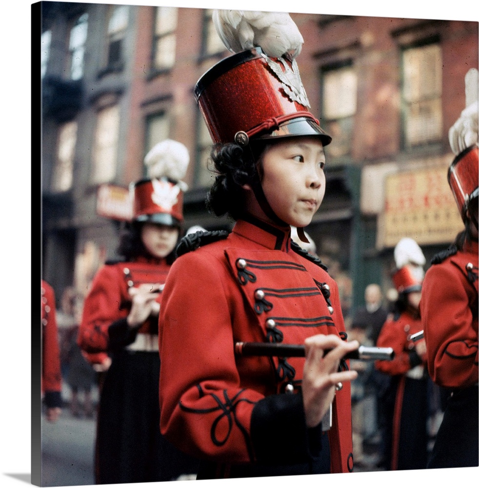 5th February 1960:  Children parade through the streets during Chinese New Year celebrations in Chinatown, New York