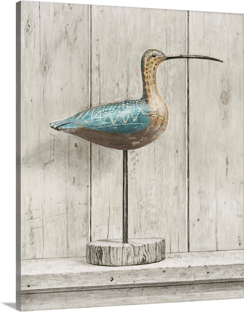 Contemporary coastal themed artwork of a wooden bird statue against a washed wood background.