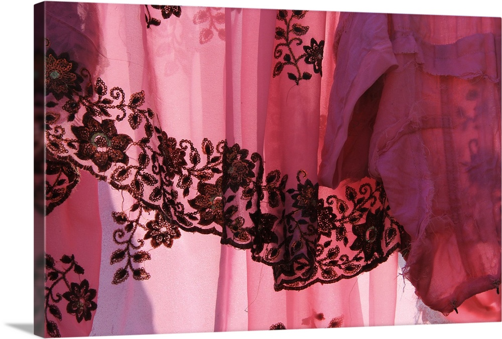 Photograph of a sheer vibrant pink fabric.