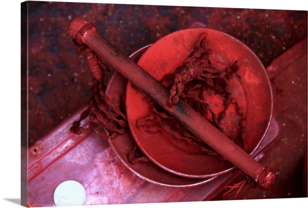 A photograph of a bowl containing bright red powder.