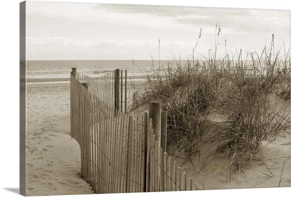 Sepia toned photograph of a beach scene from sand dunes.