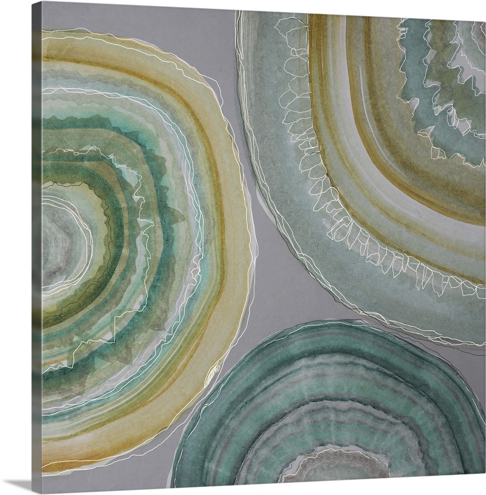Contemporary home decor artwork of pale colored geode cross sections against a gray background.