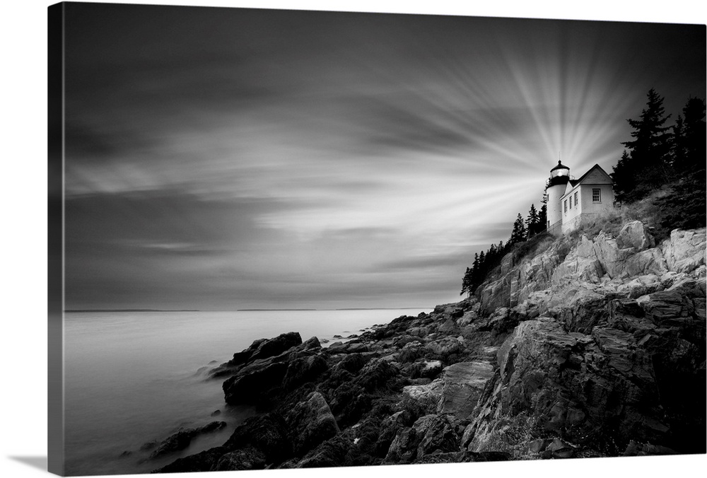 A black and white photograph of a lighthouse on the coast of Maine.