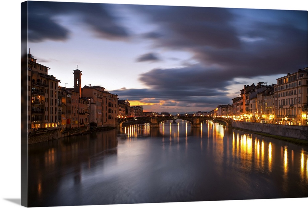 Arno, city with lights reflecting from the bridge