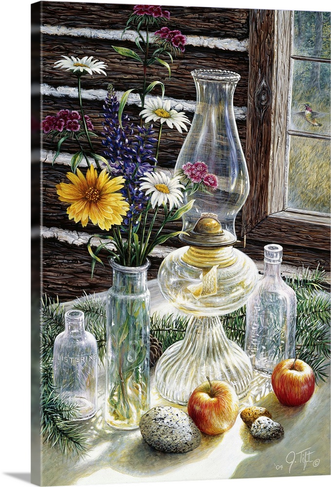 table in front of log cabin window with jars, wildflowers, oil lamp, apples, rocks