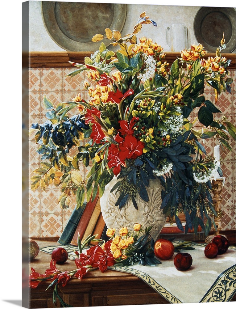 Bouquet of flowers in a white vase on a table with more flowers ready to go in the vase.