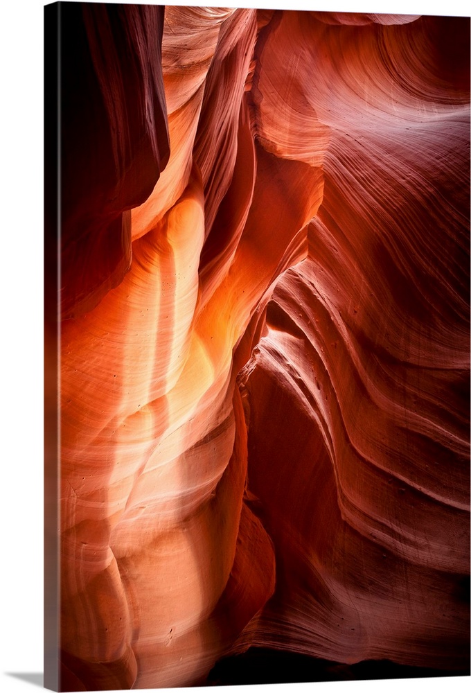 Landscape photograph of sandstone walls inside a canyon cave.