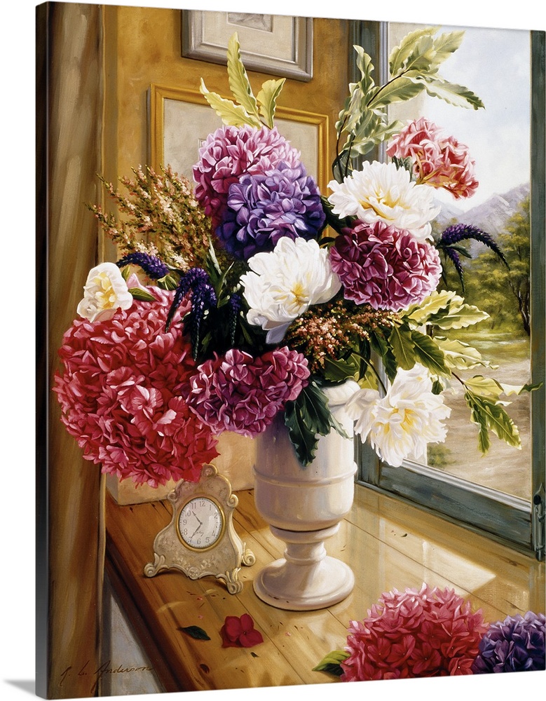 Bouquet of flowers in a tall white vase on a table with a vintage clock on it with a window overlooking a path.