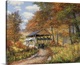 image thumbnail of Covered bridge on dirt road through autumn woods.
