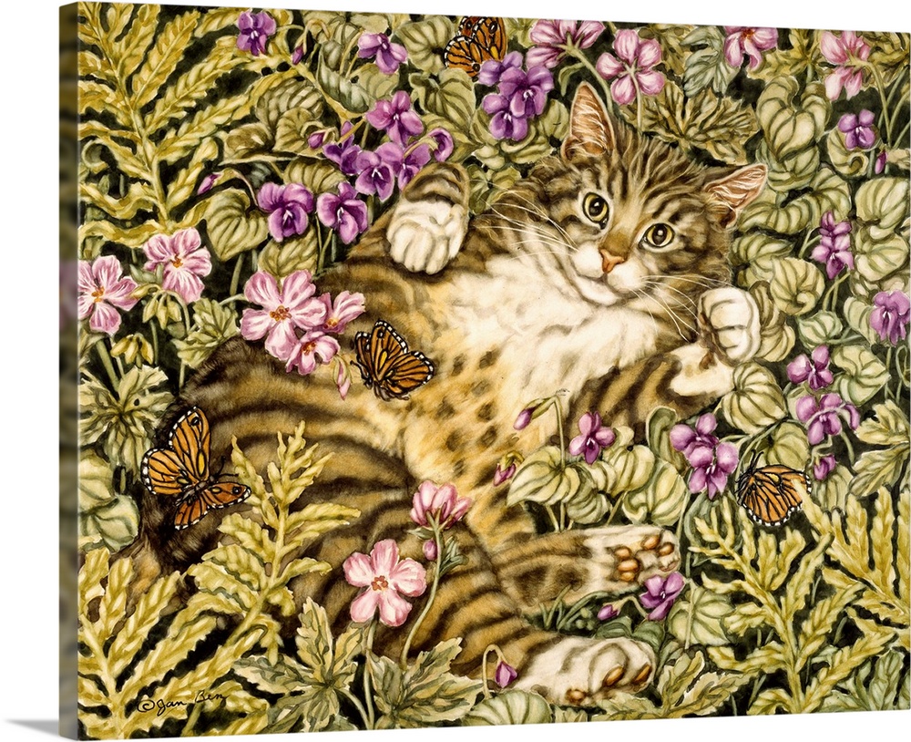 Domestic tiger cat lays on its back in a bed of ferns and flowers batting at butterflies.
