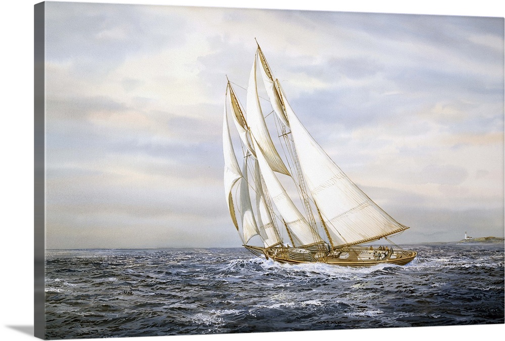 A ship with large sails sailing on ocean.