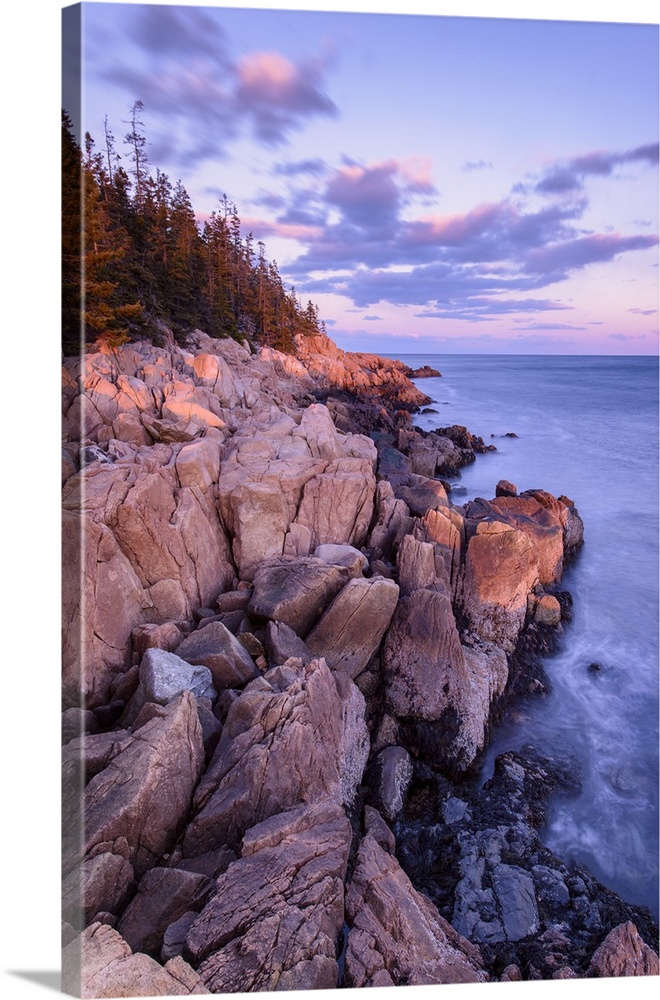 Photograph of a rocky coastline with beautiful lighting from the morning sunrise.