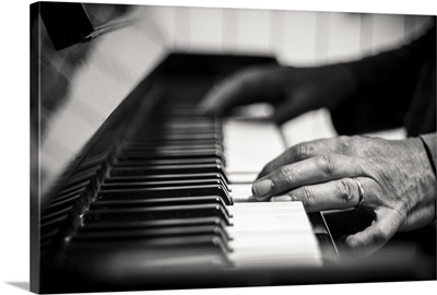 hands on a piano, black and white photography
