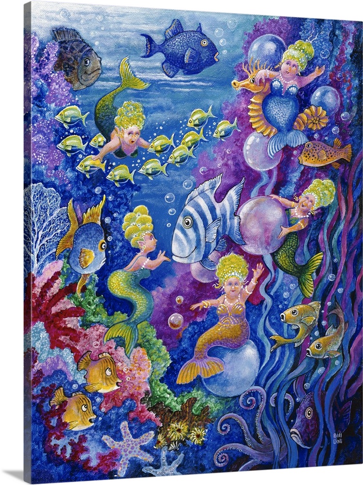 Tiny little mermaids swimming around with the fish underwater.