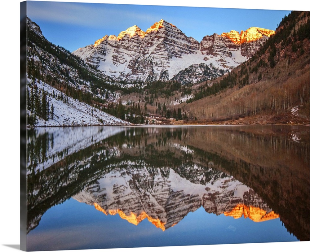 Sunlight on the peaks of the Maroon Bells, reflected in the lake below.