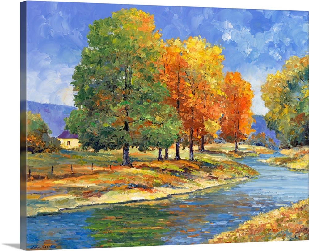 trees with changing color leaves along a riverautumn