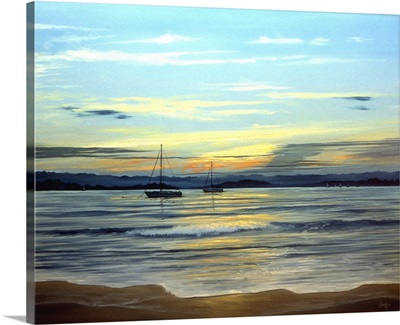 Sailboats Moored Off Beach At Sunset