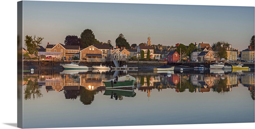 Photograph of South Portsmouth harbor reflecting onto the clear, glassy water.