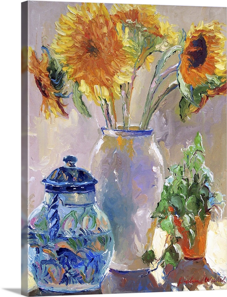 Sunflowers in a white vase.