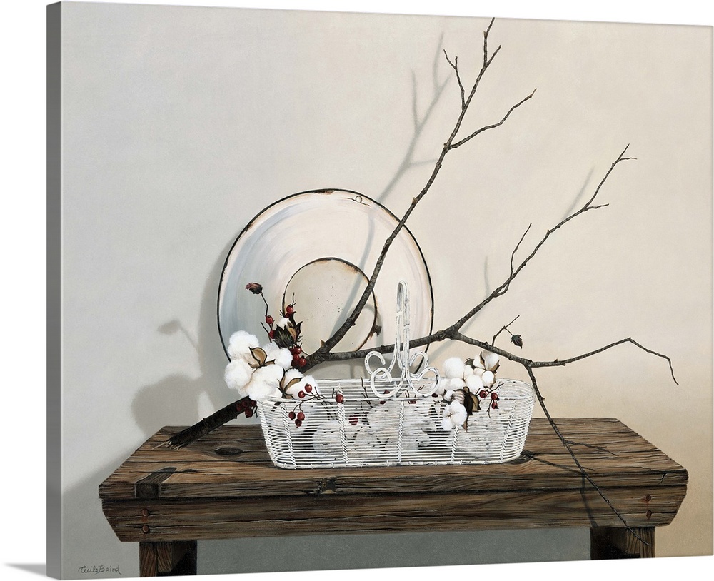 Wire basket on table with branch of cotton.