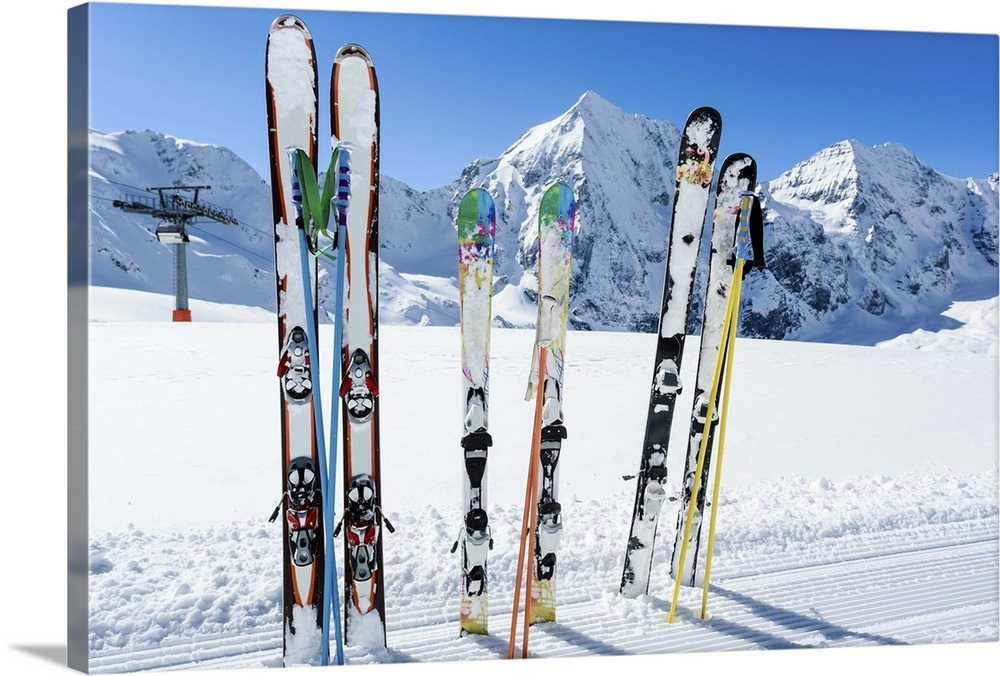Skis sticking in the snow on a mountain slope. Wall Art, Canvas Prints