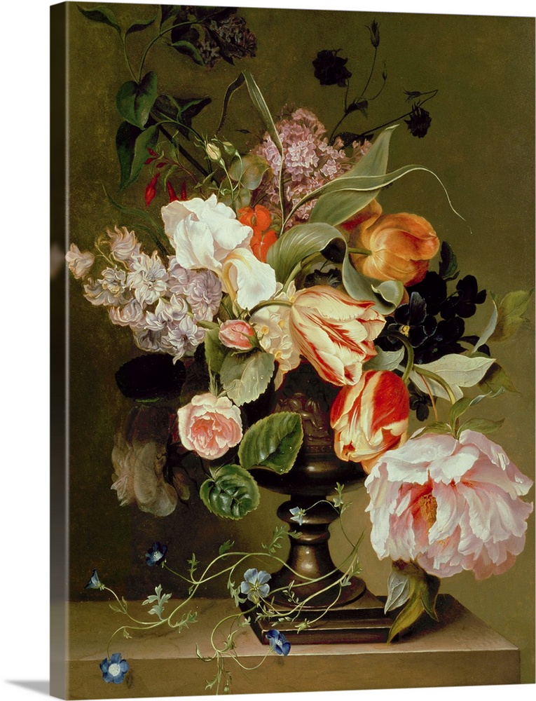 Portrait artwork on a large canvas of a floral still life.  Numerous types of lowers and leaves hang over a large vase sit...