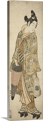 The Actor Sanogawa Ichimatsu I as a young man holding an umbrella and a lantern, c.1748