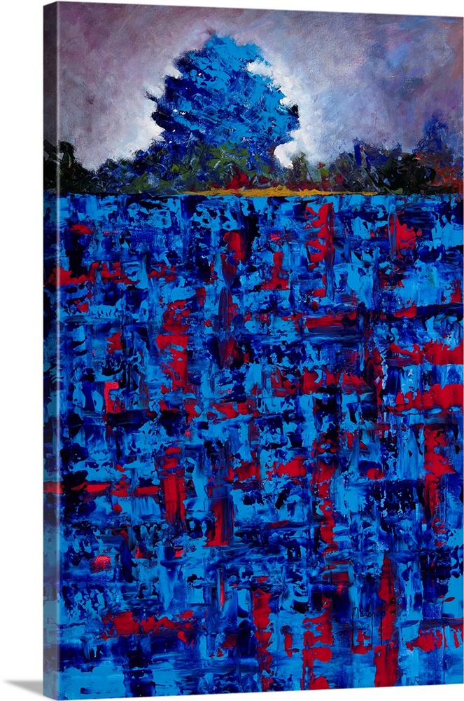 Abstract landscape created with vibrant blue and red hues of a single tree in a field.