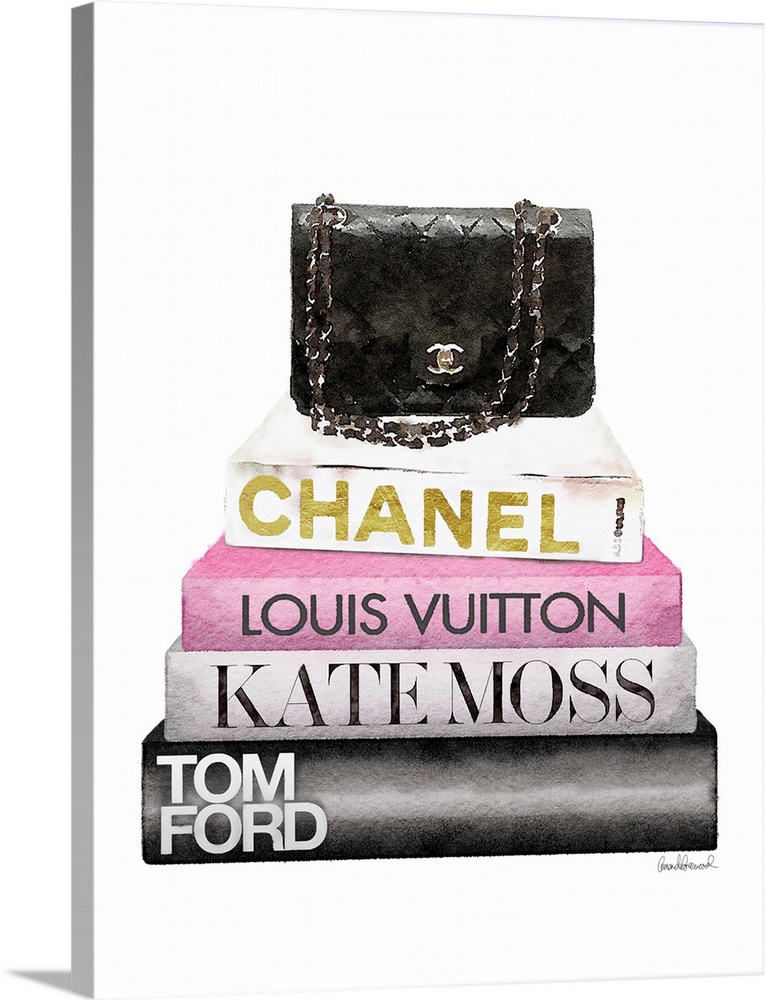 A purse sits atop a stack of designer books.