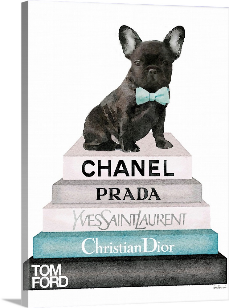 A french bulldog sits atop a stack of designer books.