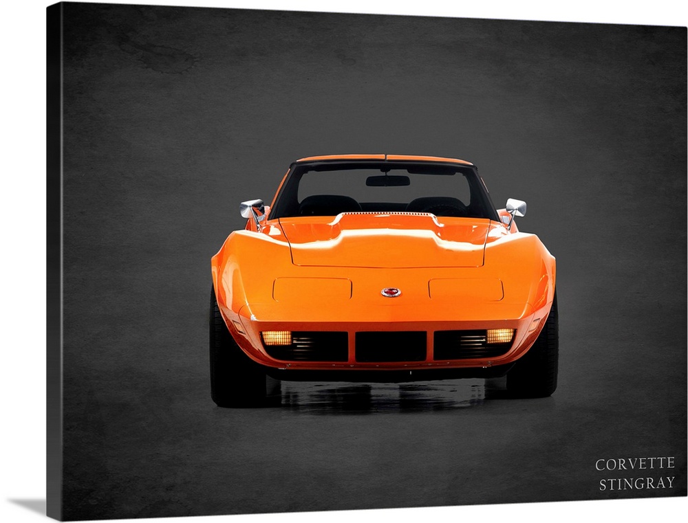 Photograph of an orange 1974 Chevrolet Corvette Stingray printed on a black background with a dark vignette.
