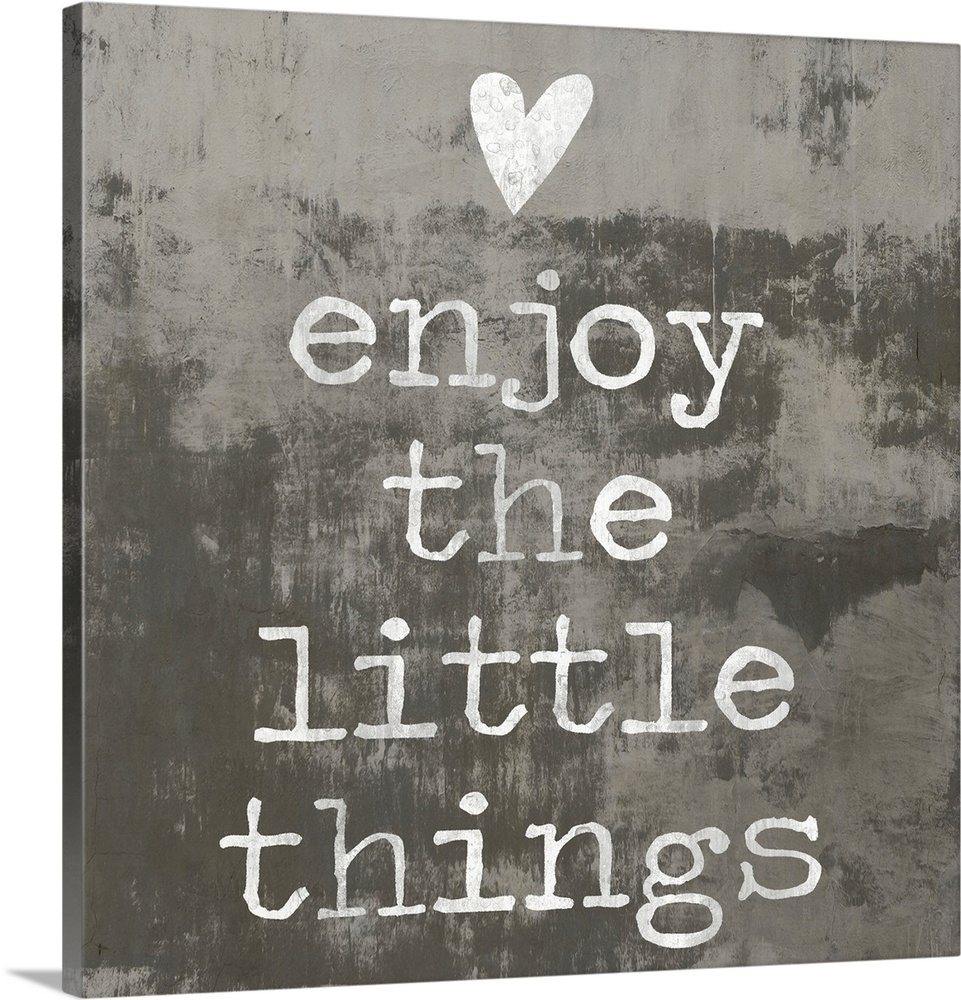"enjoy the little things" written in white with a heart above, on a background made with dark and light gray hues.