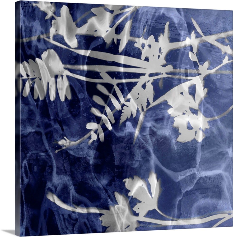 Square home decor with silver silhouettes of leaves and flowers on an indigo background with a watery look.