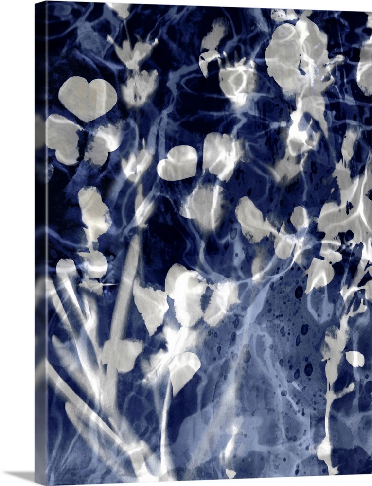 Home decor with silver silhouettes of leaves and flowers on an indigo background with a watery look.