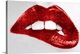 image thumbnail of Close up of a woman biting her lip with bright red lipstick