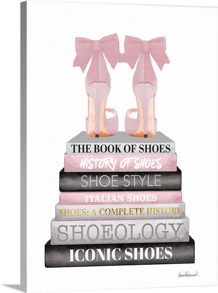 Shoes sit atop a stack of designer books.