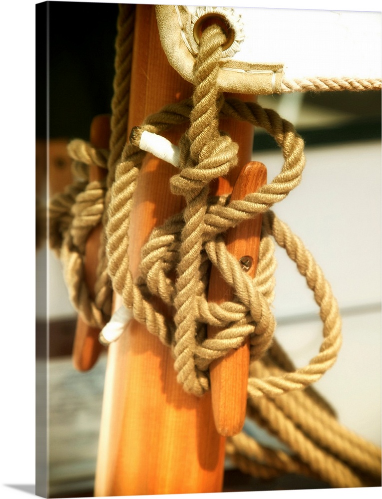 Photograph of rope tied around a sailboat cleat.