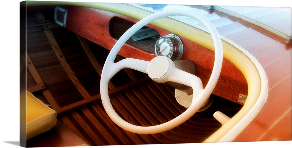 Photograph of the drivers side of a vintage speed boat with a blurred vignette.