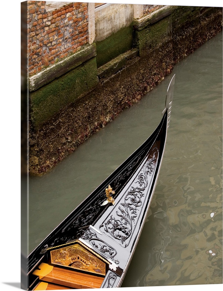 Vertical photograph of a gondola boat ride in Venice.